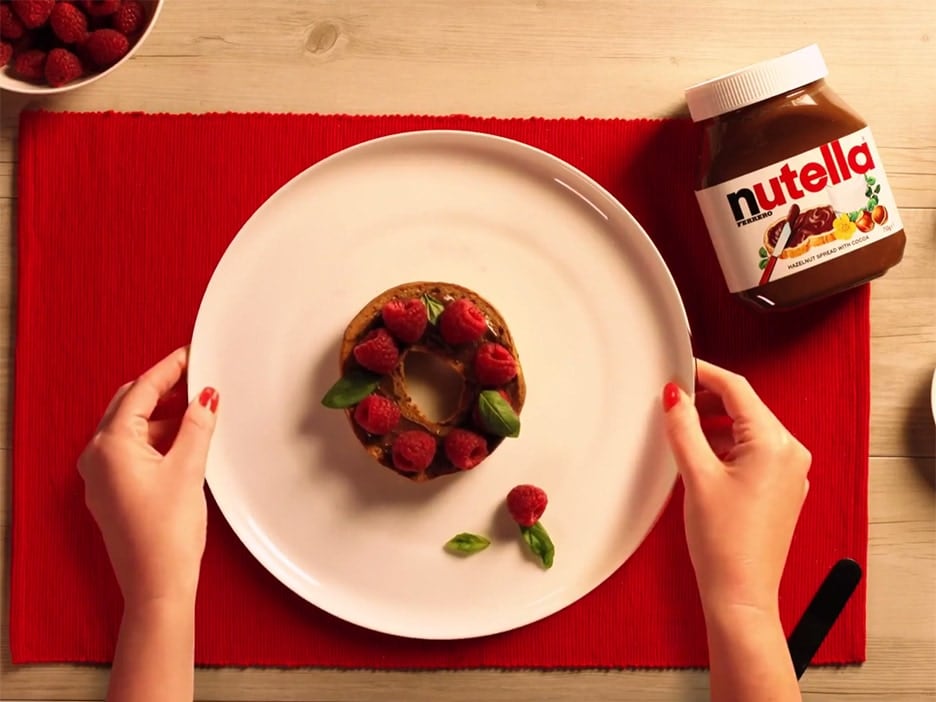 Bagel with NUTELLA®, raspberries and basil