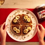 Waffles with NUTELLA®, banana and crushed hazelnuts