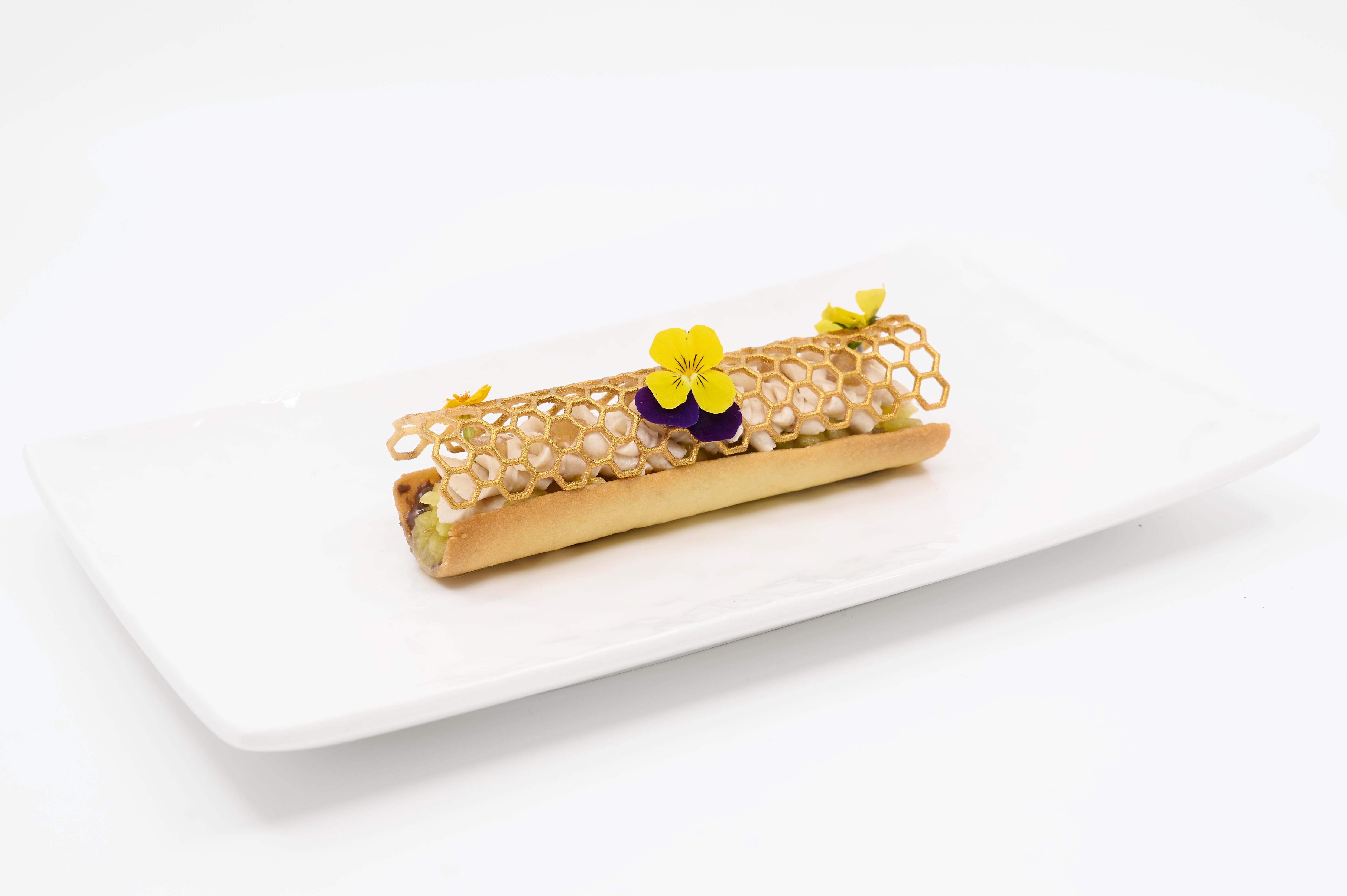 Bûche Tella : roulé glacé au Nutella, finition élégante et festive.