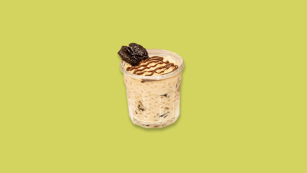 Riz au lait aux pruneaux, nappage de Nutella et touche vanillée.