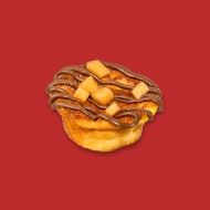 Pudding au melon servi avec filet de Nutella et menthe fraîche.