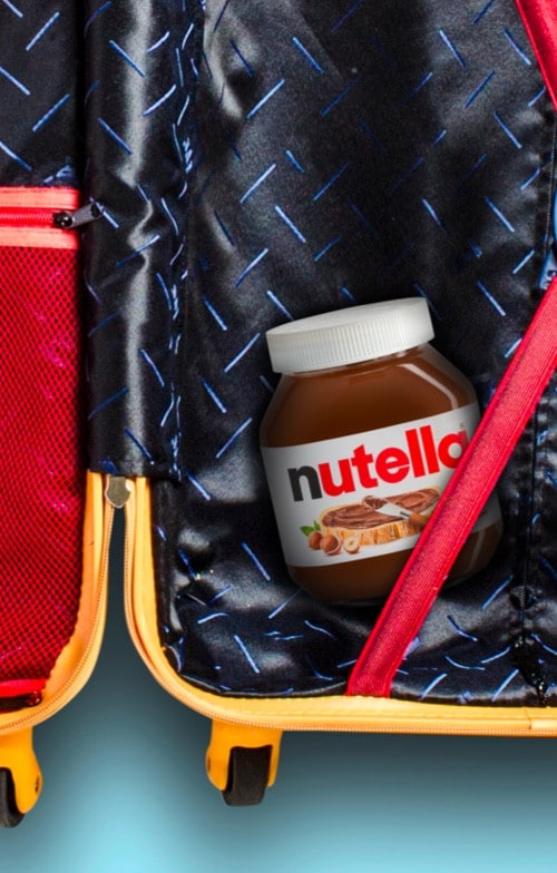 Voyagez avec votre pot de Nutella, illustration avec chariot et valise.