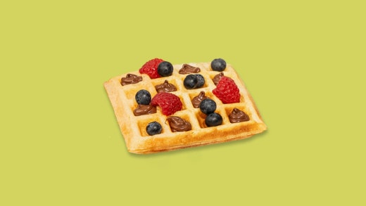 Gaufres dorées servies avec Nutella et fruits frais.