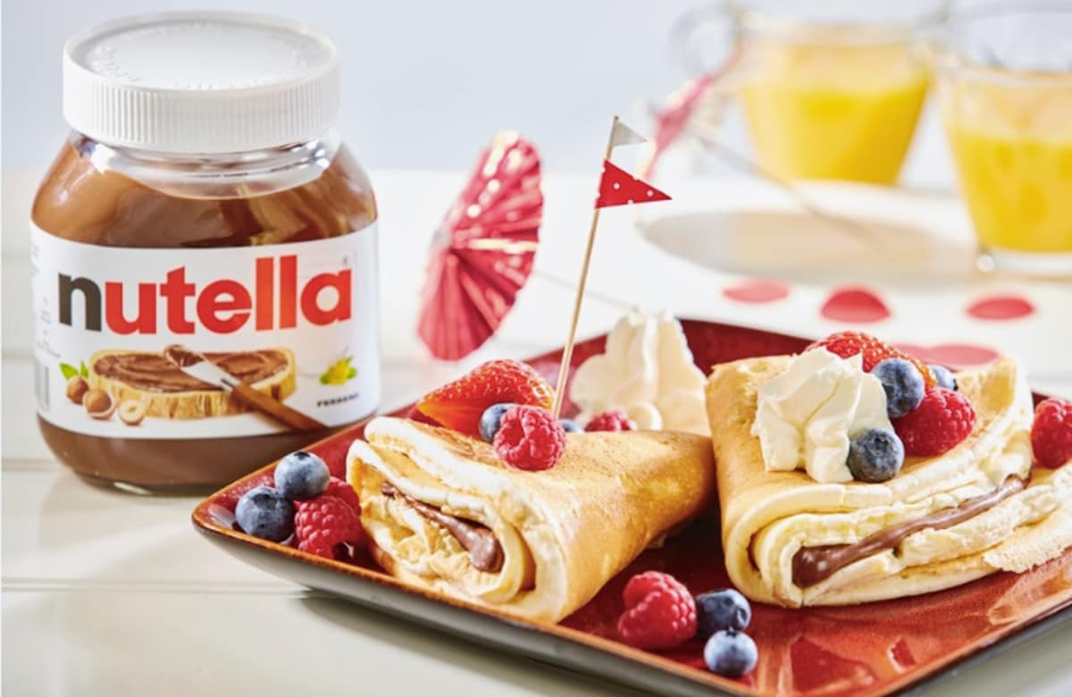 Crepes with fruit and whipped cream and Nutella®
