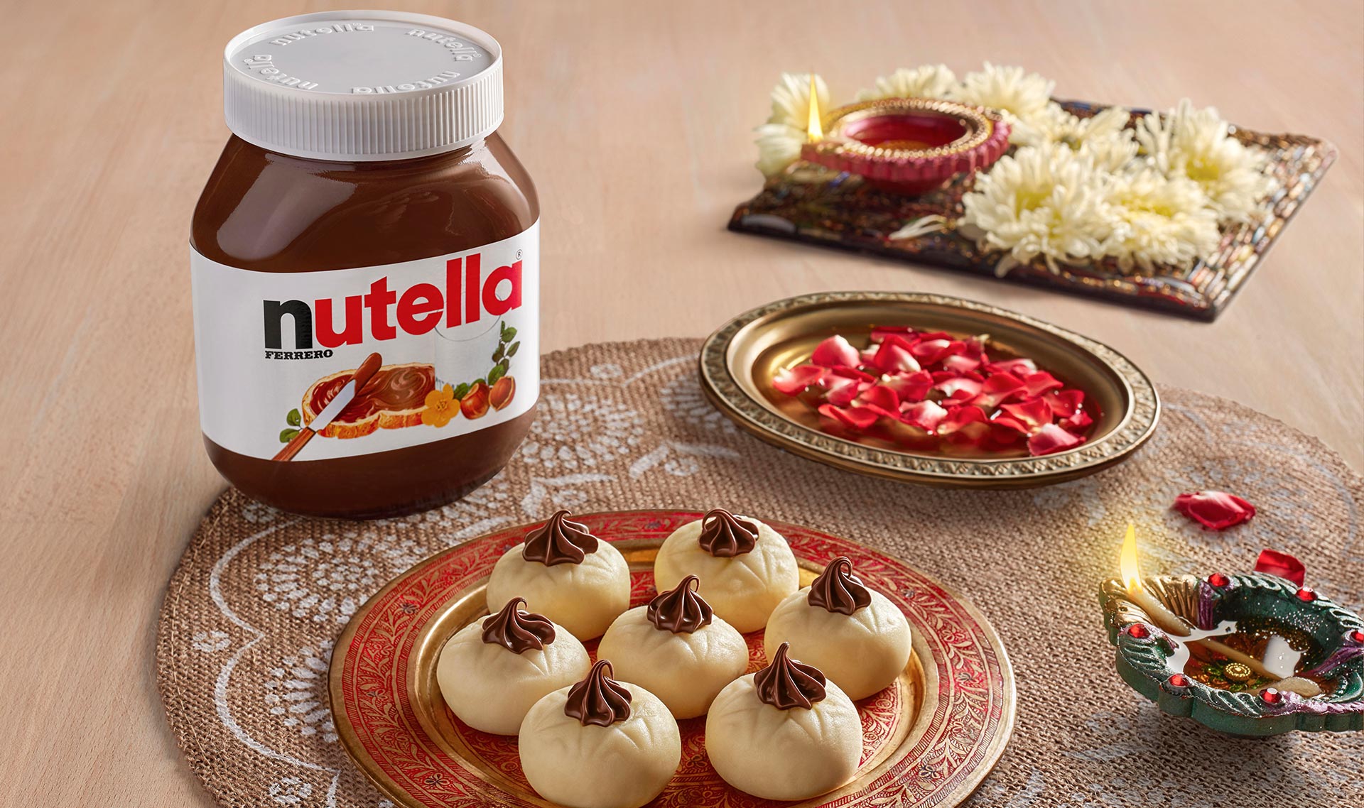 Doodh peda sweets decorated with Nutella for festive Diwali treats.