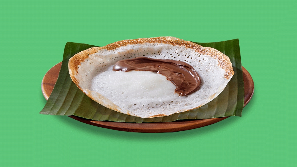 Kerala appam served with Nutella in a regional fusion breakfast recipe.