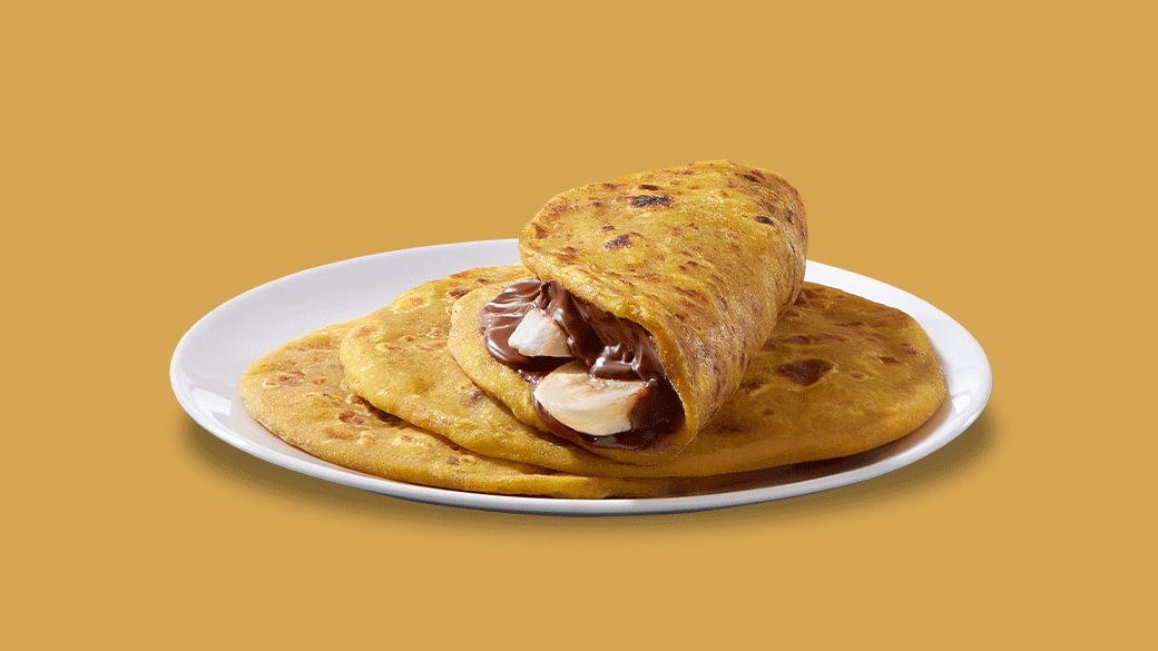 Maharashtra puranpoli flatbread served with Nutella and powdered sugar.