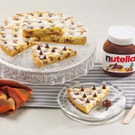 Nutella crostata tart with glossy chocolate filling and golden crust.