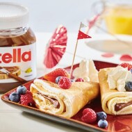 Sponge cake crepes with fruit and whipped cream