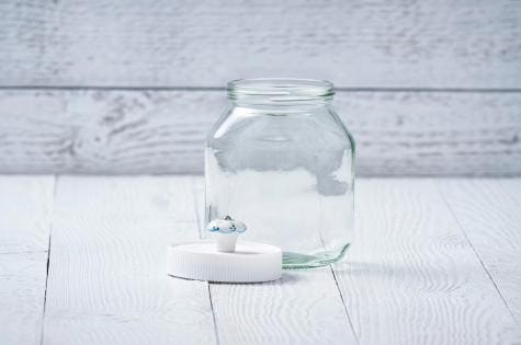 Nutella gift jar craft step showing jar being prepared.