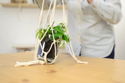 Nutella jar craft step showing decorative hanging jar assembly.