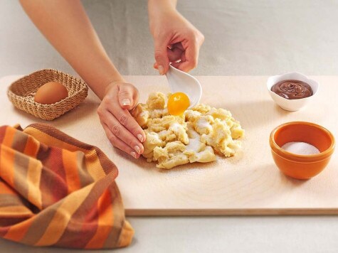 Nutella crostata preparation step showing dough being shaped.