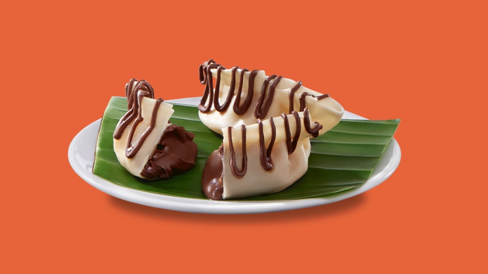 West Bengal-style momos filled with Nutella, presented with dipping sauce.