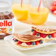 Pancakes with fruit and whipped cream