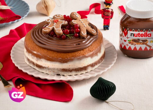 Torta con omini di pan di zenzero e ripieno alla Nutella, decorata.