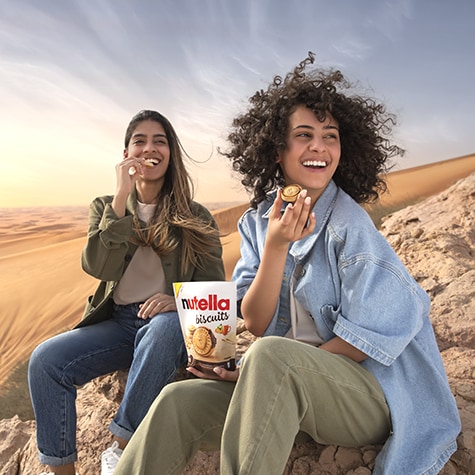Lifestyle photo of people enjoying Nutella products at the breakfast table.
