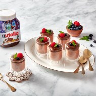 Light chocolate mousse flavored with Nutella, served in a glass cup.