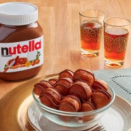 Ghuraiba butter cookies with Nutella filling and powdered sugar dusting.