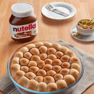 Khaleyet Al Nahel pastries filled with Nutella and topped with pistachios.