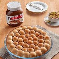 Khaleyet Al Nahel pastries filled with Nutella and topped with pistachios.
