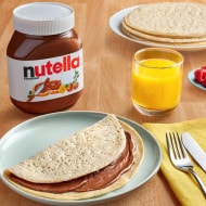 Lahooh Al Hatharmi flatbread drizzled with Nutella and sliced bananas.