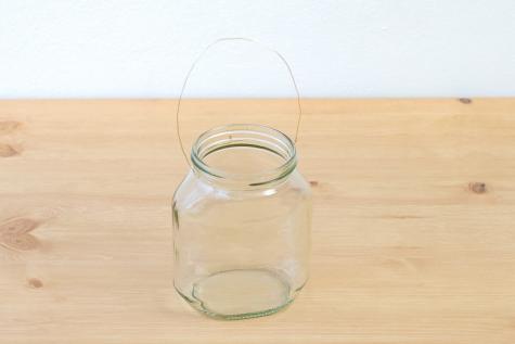 Nutella jar wall garden craft in step five of decoration.