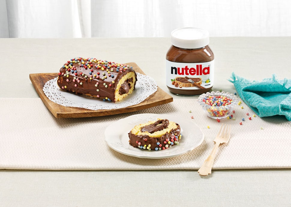 Carnival roll pastry swirled with Nutella and dusted with sugar.