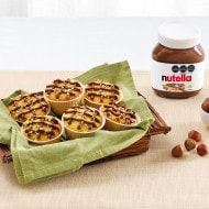 Variedad de muffins con Nutella en tres sabores, presentados en bandeja.