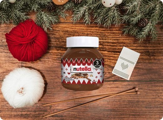 Ideas de reciclaje creativo: frasco de Nutella convertido en maceta decorativa.