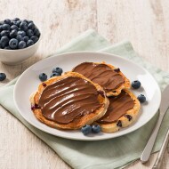 Mini blueberry buttermilk pancakes with Nutella® and strawberries