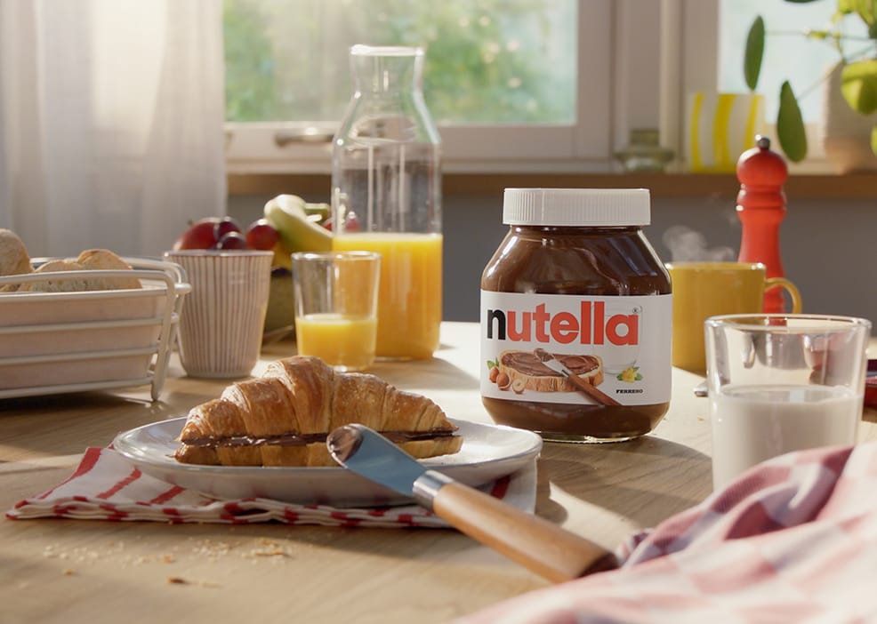 Toasted croissant filled with Nutella and dusted with sugar.