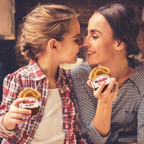 Introductory Nutella muffin close-up with gooey filling, promotional food photo.
