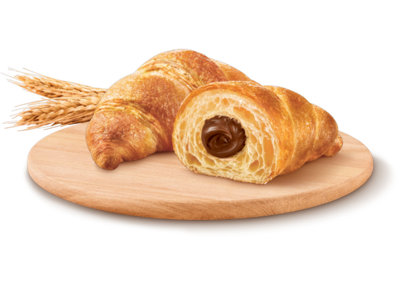 Flaky croissant filled with Nutella chocolate-hazelnut spread on white background.