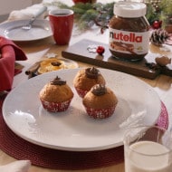 Styled muffins with Nutella swirl on top, holiday-themed photo.