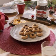 Gingerbread men biscuits decorated with Nutella filling and icing.