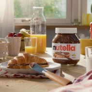 Toasted croissant filled with Nutella and dusted with sugar.