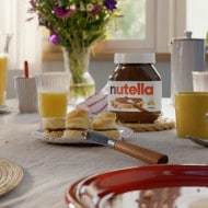 Warm scones served with clotted cream and Nutella.