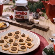 Heart-shaped cookies filled with Nutella and decorated with icing.
