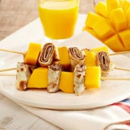 Collage of Nutella recipes from around the world, various plated dishes.
