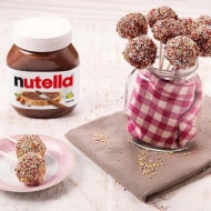 Assorted Nutella cake pops dipped in chocolate and decorated with sprinkles.