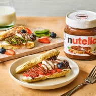 Nutella® strawberry and blueberry soda bread farls served with fresh fruit, crème fraîche, and a Nutella® jar.