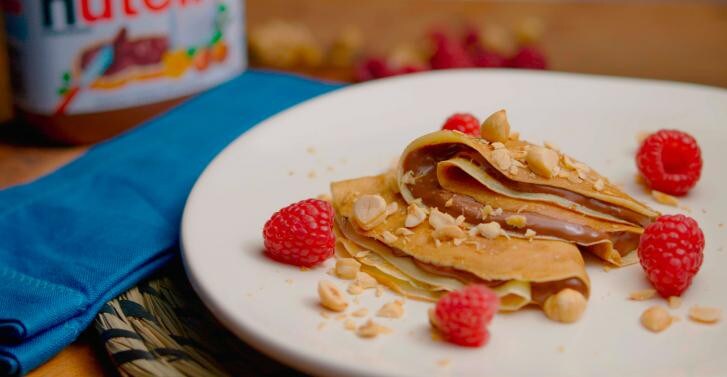 Crepes with nutella® with raspberries & toasted hazelnuts