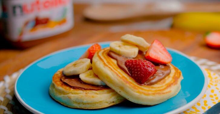 Pancakes with nutella®, strawberries and banana