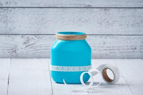 Step three: securing penholder insert inside Nutella jar craft.