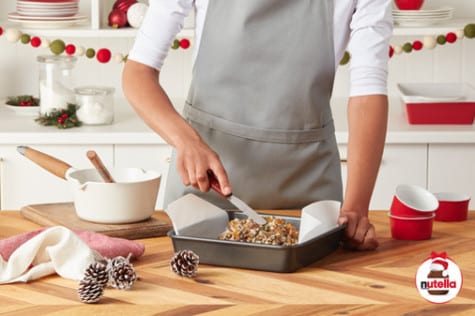 Step two: layering sugar and oils into Nutella beauty jar DIY.