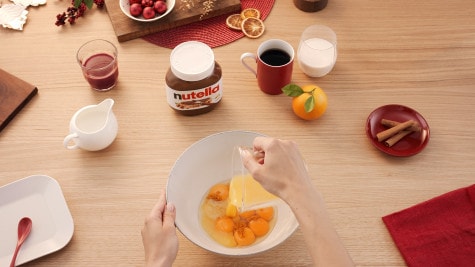 Pineapple and mango waffle topped with Nutella and fresh tropical fruit.