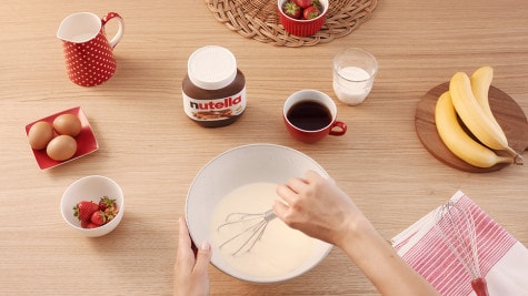 Preparing materials to make Nutella jar Easter bunny craft, step one.