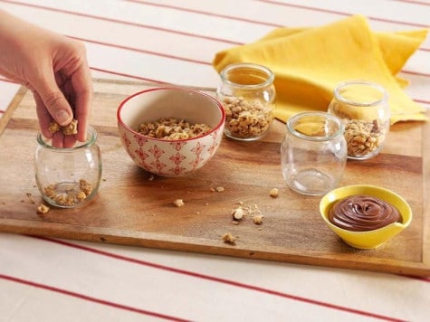 Yoghurt recipe step one combining Nutella and yoghurt in bowl.