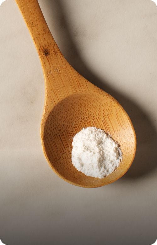 Spoonful of vanilla powder representing flavoring ingredient in Nutella recipe.