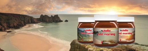 Nutella promotional desk display featuring jar, toast, fruit and breakfast props.